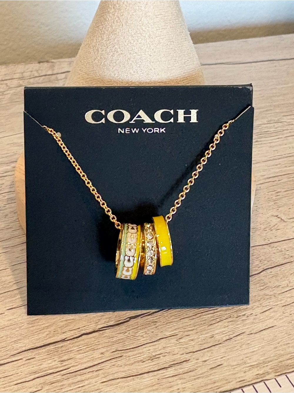 Coach Gold-Tone Rondel Necklace with Yellow Enamel & Crystal Ring Charms